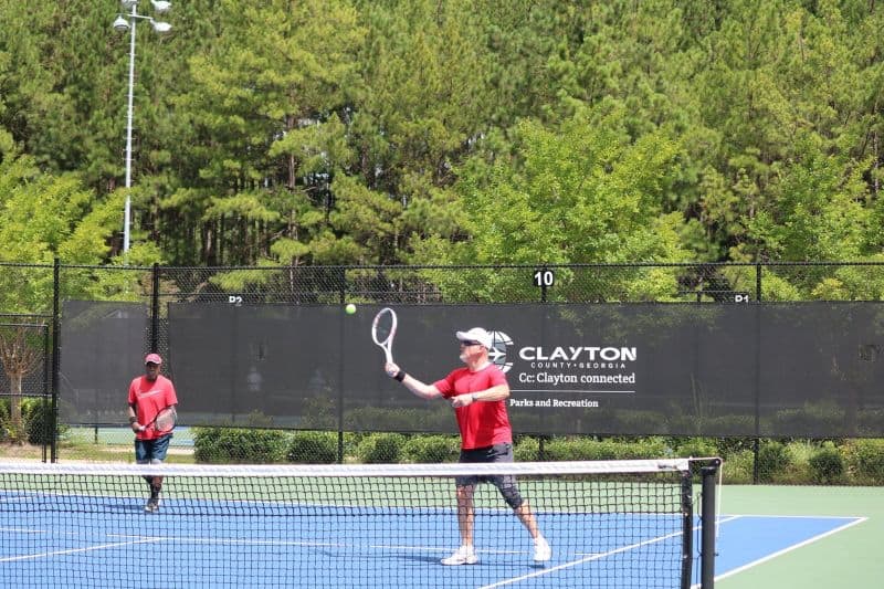 Two men playing tennis