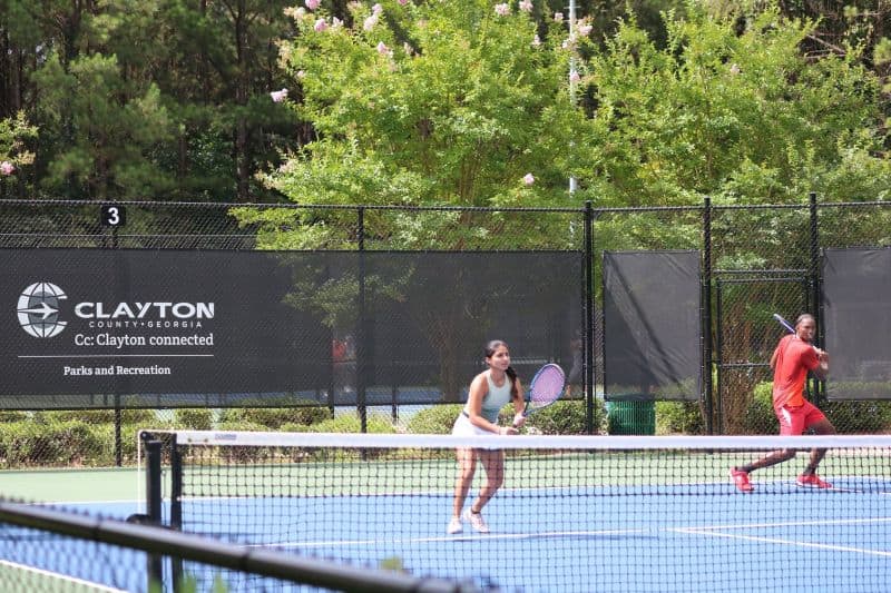 Woman and man playing tennis
